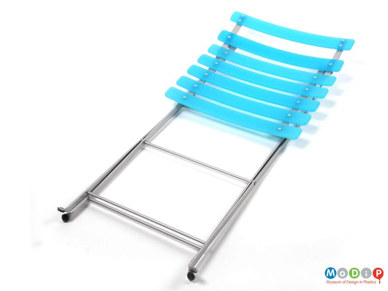 Top view of an Habitat folding chair showing the chair folded.