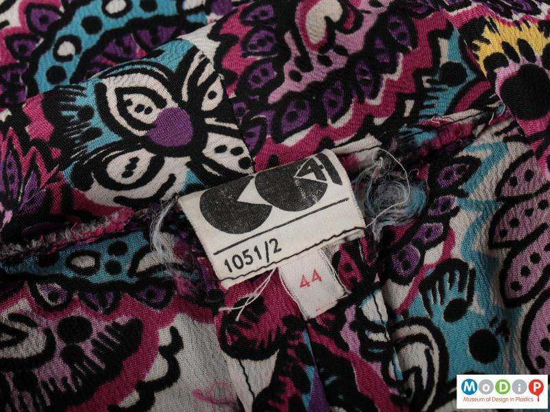 Close view of a blouse showing the label.