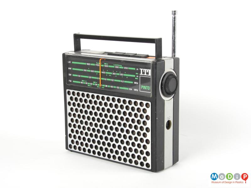 Side view of an ITT Pinto radio showing the round dial and connection point.