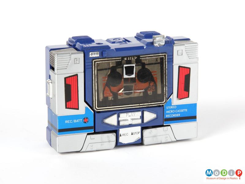 Front view of a Tranformers Soundwave showing the micro cassette recorder with the cassette in place.