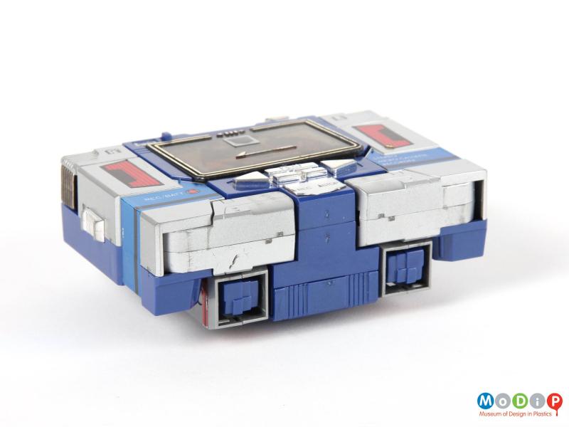 Underside view of a Tranformers Soundwave showing the grey and blue sections of the cassette recorder.