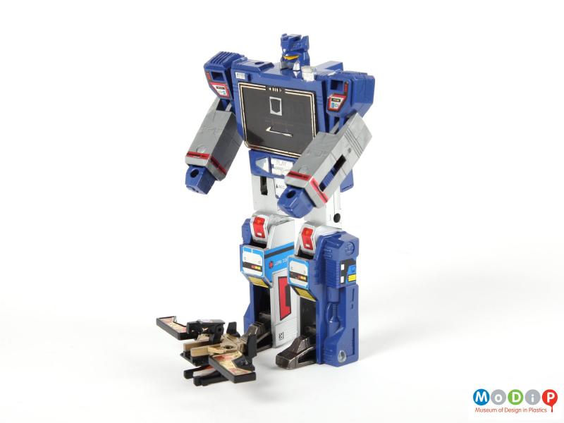 Side view of a Tranformers Soundwave showing both the recorder and the cassette transformed into their corresponding robot shapes.