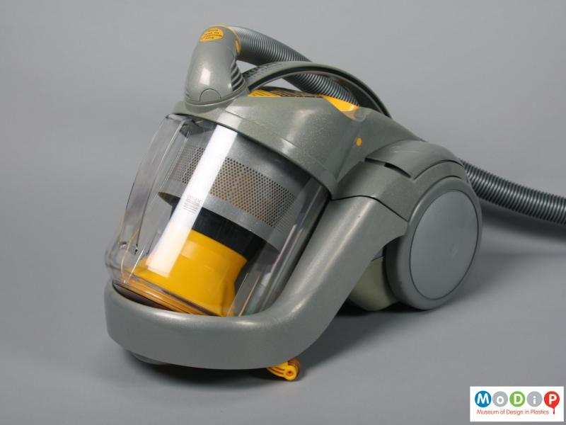 Front view of a vacuum cleaner showing the clear bin.
