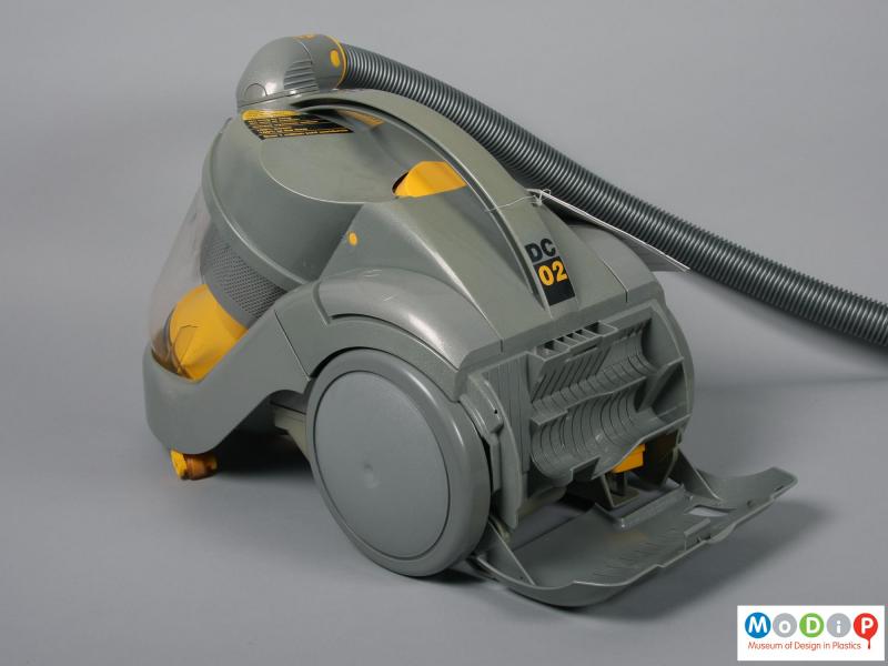 Rear view of a vacuum cleaner showing the open cover.
