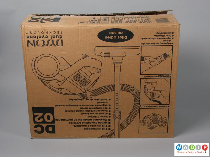 Side view of a vacuum cleaner showing the packaging.