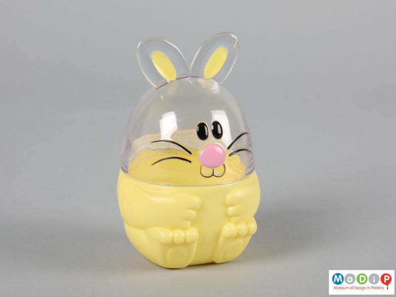 Front view of a Funny Bunny sweet container showing the moulded feet shapes in the base and face in the top section.