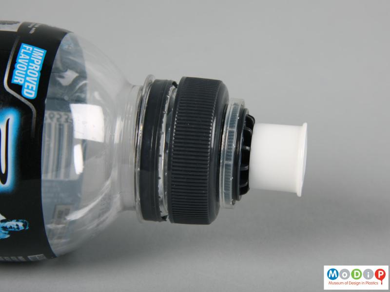 Side view of a Powerade bottle showing the pull cap closed.