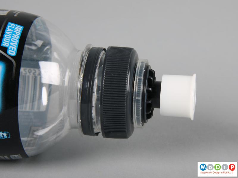 Side view of a Powerade bottle showing the pull cap open.