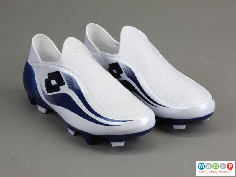 Front view of a pair of football boots showing the moulded markings on the upper.