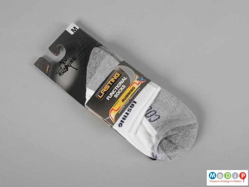 Front view of a pair of socks showing the packaging.