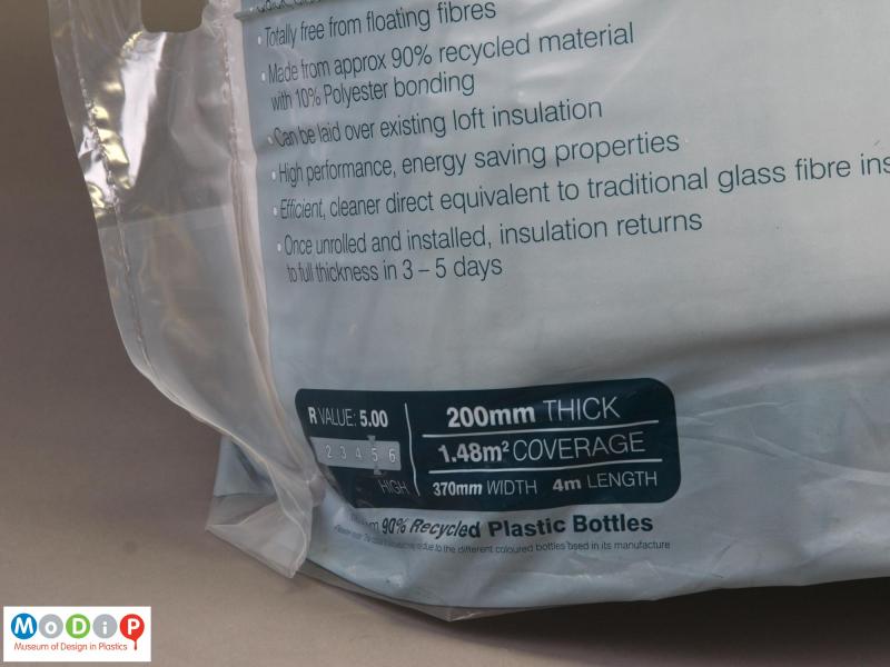 Close view of a B&Q insulation roll showing the text on the packaging stating the insulation is made from 90% recycled plastic bottles.