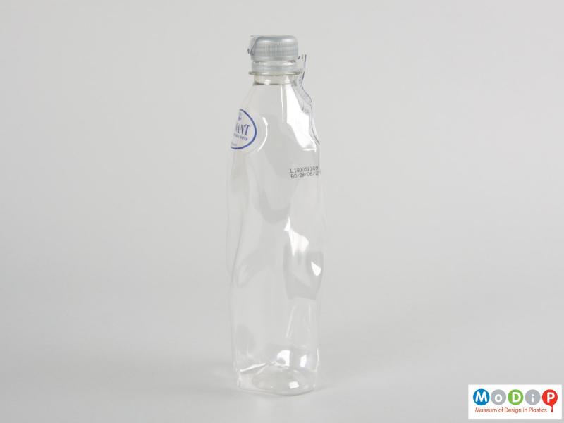 Side view of a bottle showing the contours of the body.