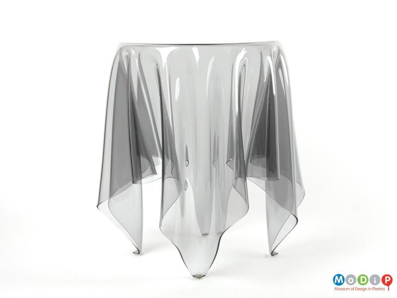 Side view of an Illusion table showing the drape of the material and the legs.