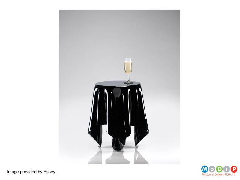 A publicity image of the Illusion table provided by Essey and showing a solid black example.
