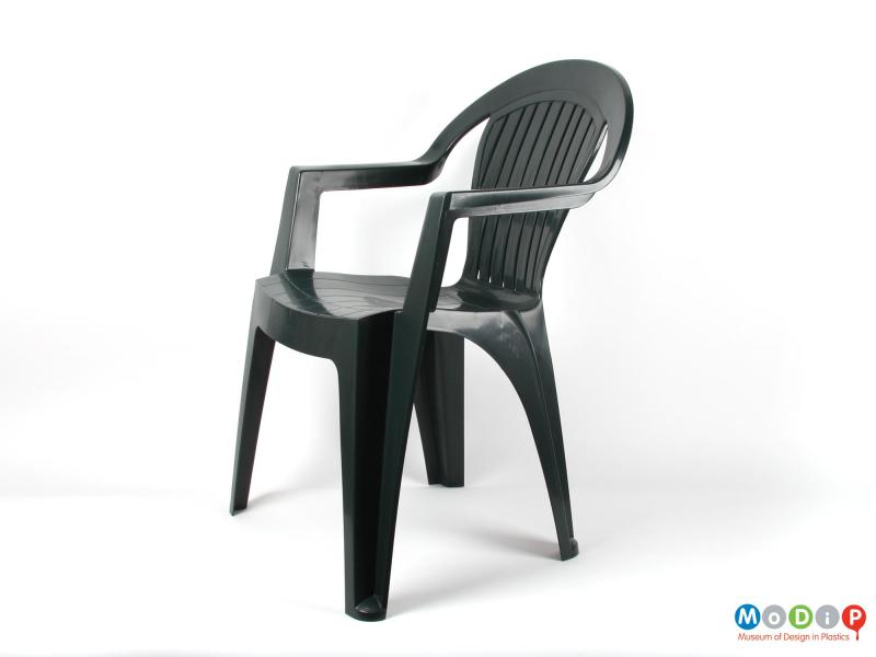 Side view of a chair showing the angular arm rests.