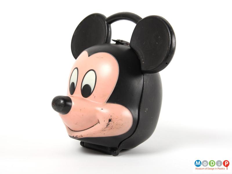 Side view of a Mickey Mouse lunch box showing the profile of the face.