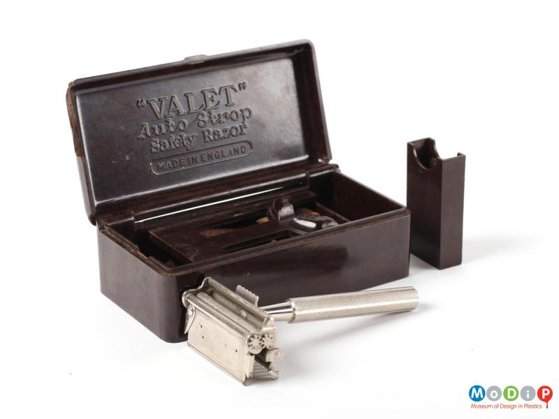 Front view of a Valet safety razor box showing the saftey razor and the spare blade holder out of the box.