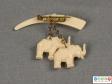 Rear view of a brooch showing the hanging elephants.