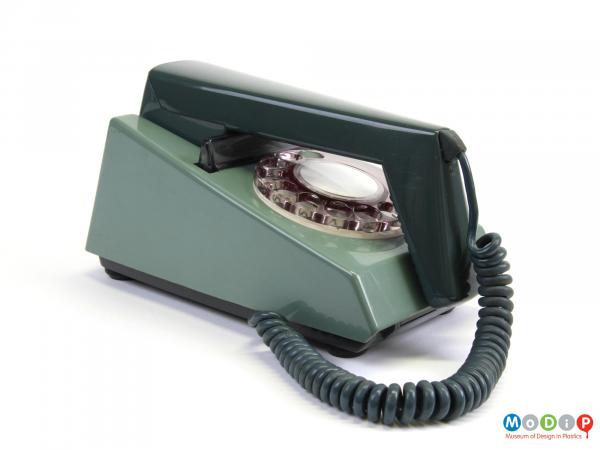 Side view of a telephone showing the angular handset.