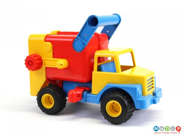 Side view of a toy truck showing the carry handle.