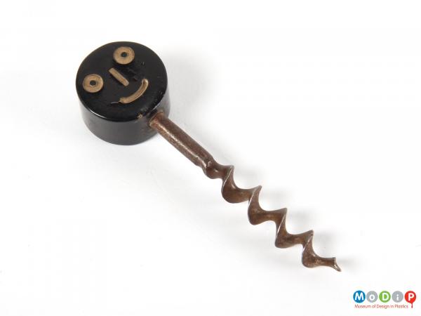 Front view of a corkscrew showing the smiling face.