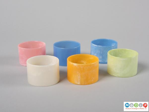Side view of a set of napkin rings showing the different colours.