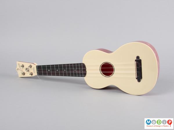 Front view of a ukulele showing the four strings.