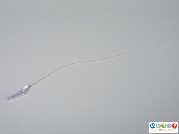 Side view of a catheter suction mully showing tube and tip.