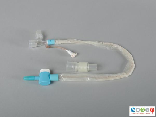 Side view of a trach care device showing the two separate parts.