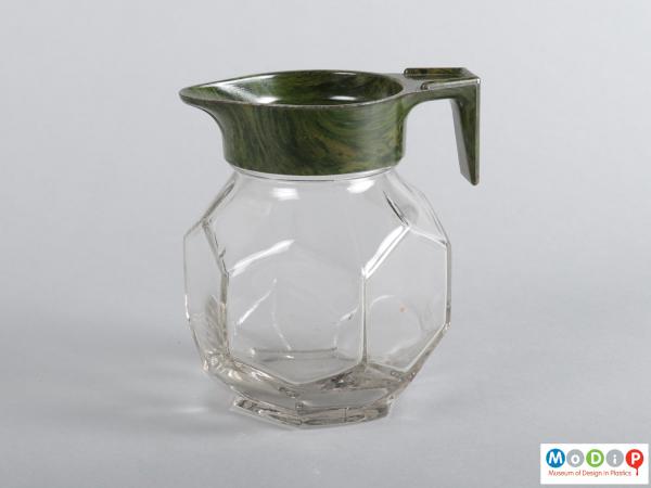 Side view of a jug showing the hexagonal shaped glass body.