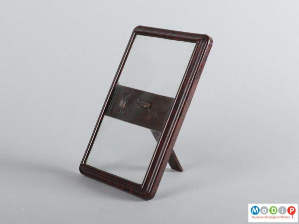 Side view of a photograph frame showing the glass panel and rear strap.