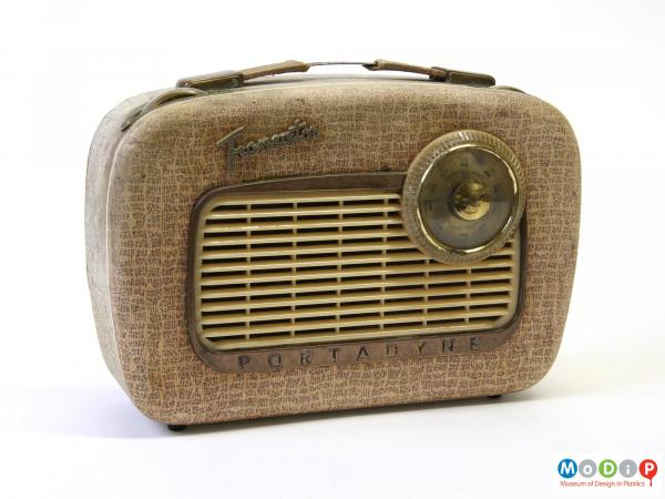 Front view of a Portadyne transistor radio, with round dial and grill.