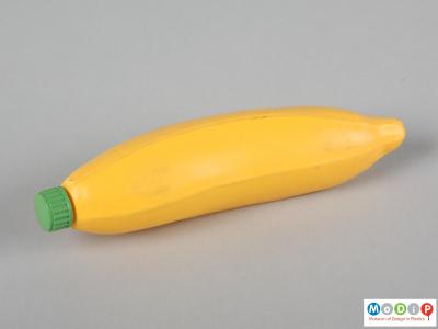 Side view of a Flip Syrup banana bottle showing realistic moulding.