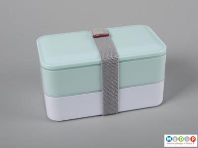 Top view of a lunch box showing the compartments held together.