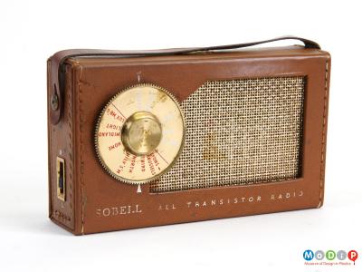 Front view of a Sobell All transistor radio, showing a sewn leatherette cover and a round dial.