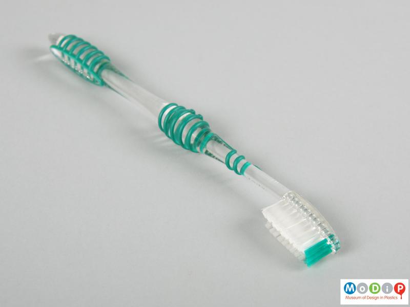 Side view of a toothbrush showing the tapering head.