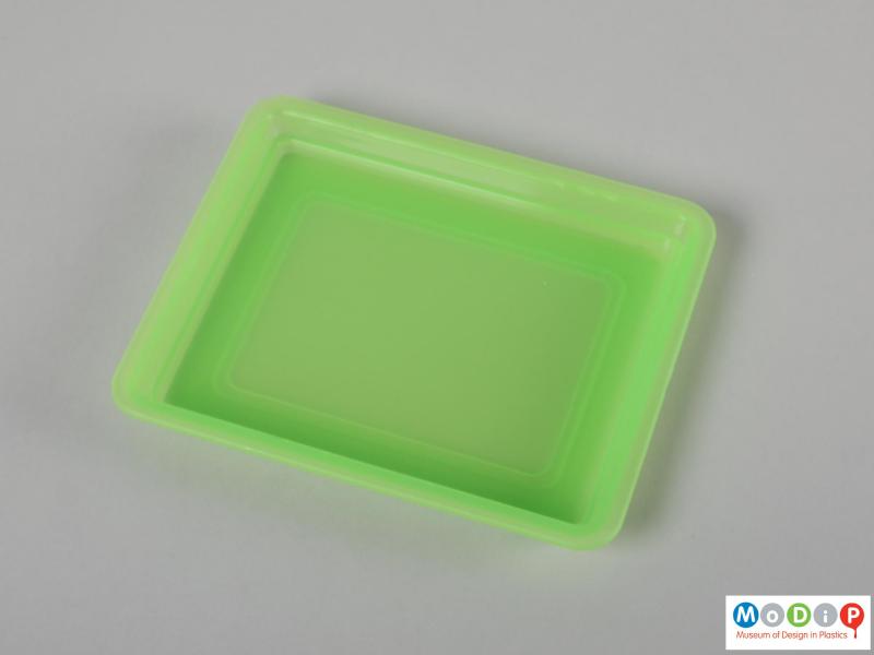 Top view of a butter dish showing the inside surface of the base.