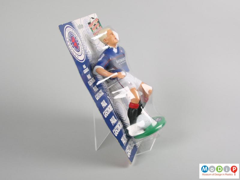 Side view of a Paul Gascoigne figure showing the vacuum formed packaging.