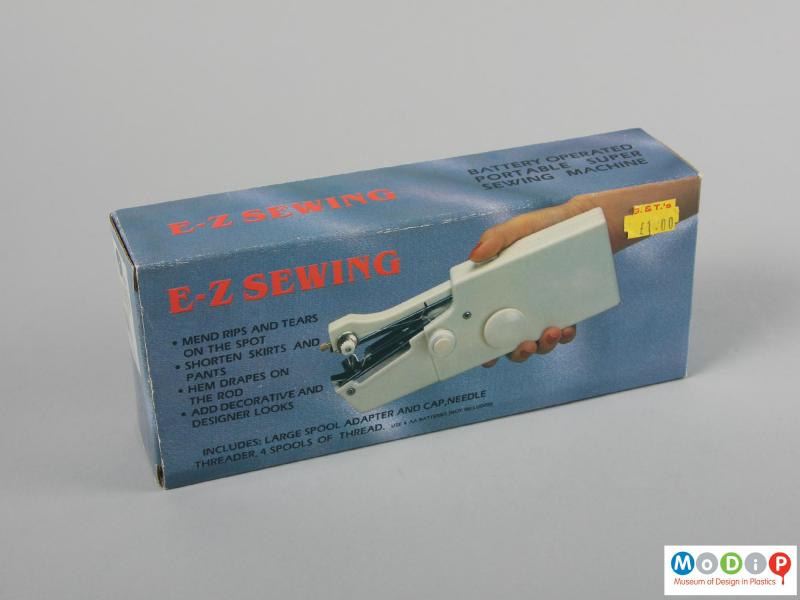 Side view of a sewing machine showing the packaging.