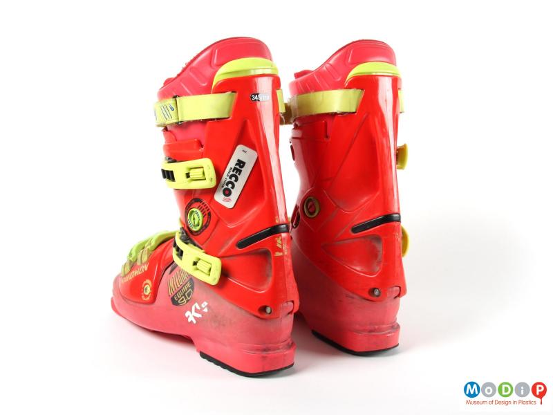 Rear view of a pair of ski boots showing the leg supports.