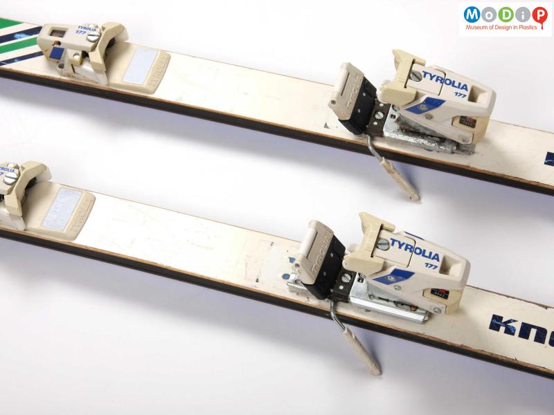 Close view of a pair of Kneissl skis showing the foot clips.