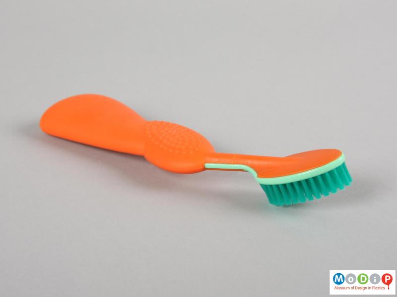 Side view of a toothbrush showing the large handle and brush head.
