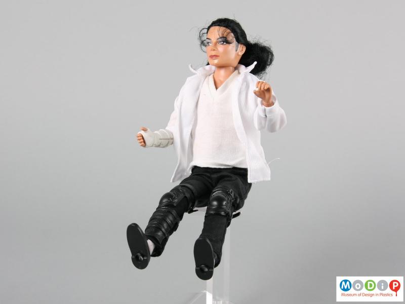 Front view of a Michael Jackson doll showing the articulation in the arms and legs.