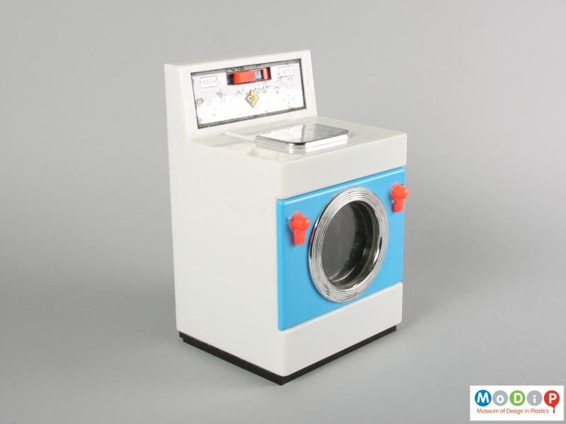 Side view of a Casdon toy washing machine showing the plain side and blue door on the front.