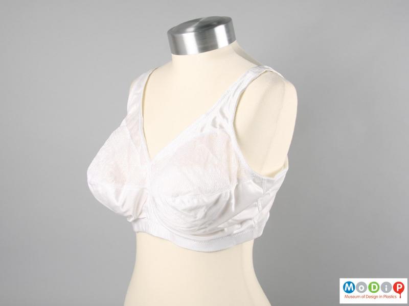 Side view of a bra showing the wide shoulder straps.