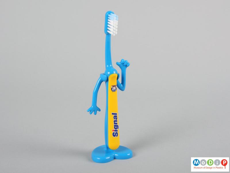 Front view of a Signal toothbrush showing the brush in the holder.