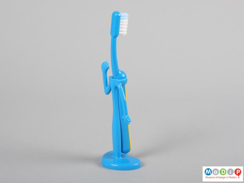 Rear view of a Signal toothbrush showing the brush in the holder.