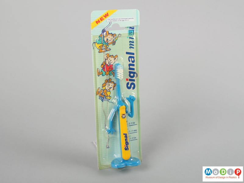 Front view of a Signal toothbrush showing the brush in the packaging.