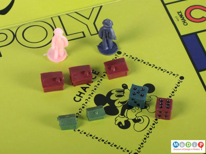 Close view of a board game showing some of the playing pieces.