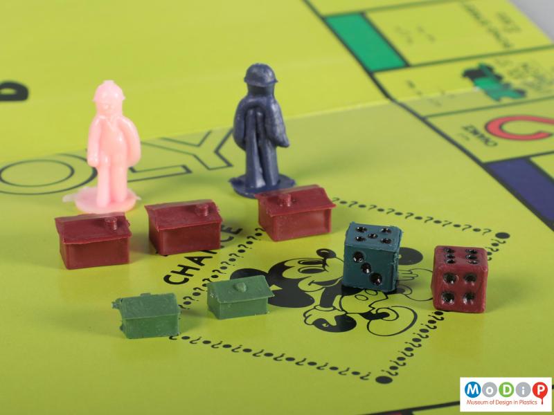 Close view of a board game showing some of the playing pieces.